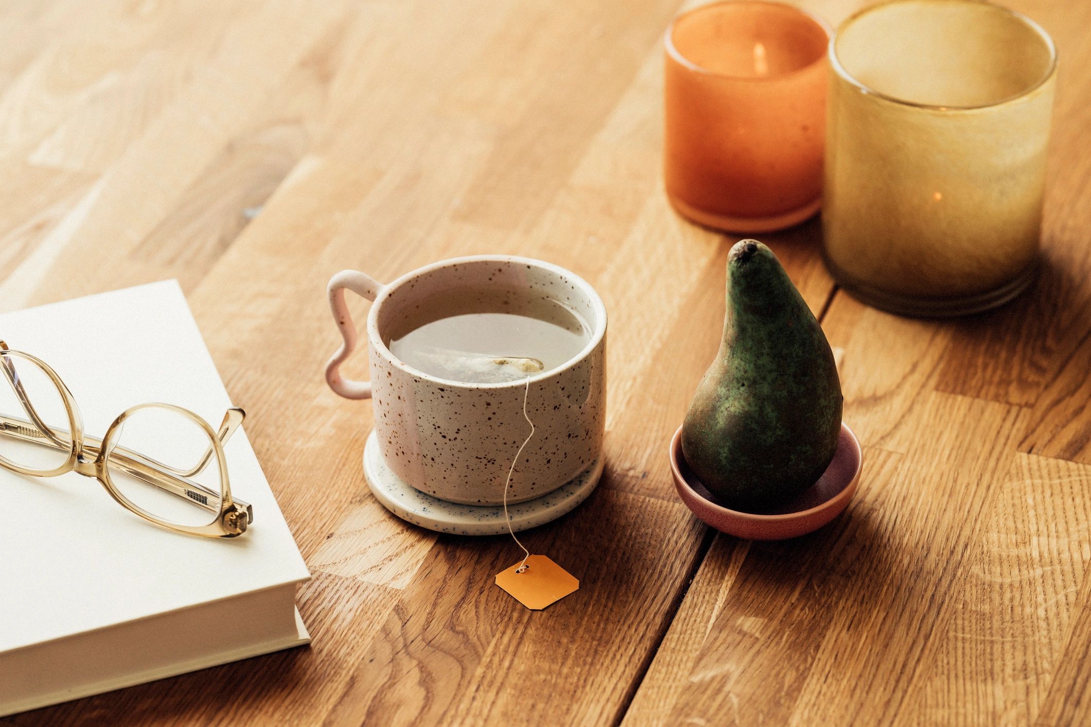 Herbal tea with book and candles